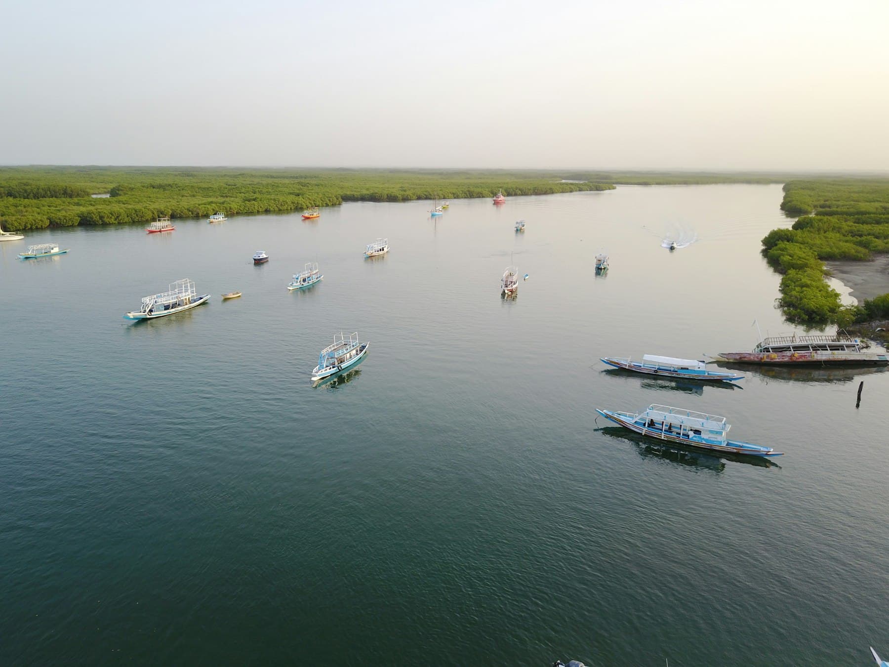 Boats on the wide River Gambia